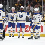 May 1, 2026; Boston, Massachusetts, USA; As Boston Bruins defenseman Charlie McAvoy (73) skates away, Buffalo Sabres right wing Alex Tuch (89) smiles at teammates after scoring during the first period of game six of the first round of the 2026 Stanley Cup Playoffs at TD Garden.