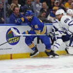 Mar 14, 2026; Buffalo, New York, USA; Buffalo Sabres right wing Alex Tuch (89) and Toronto Maple Leafs right wing William Nylander (88) go after a loose puck during the third period at KeyBank Center.