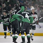 Apr 28, 2026; Dallas, Texas, USA; Dallas Stars left wing Jason Robertson (21) and defenseman Miro Heiskanen (4) celebrates a goal scored by Heiskanen against the Minnesota Wild in game five of the first round of the 2026 Stanley Cup Playoffs at American Airlines Center.