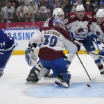 Mar 19, 2025; Toronto, Ontario, CAN; Toronto Maple Leafs forward Bobby McMann (74) watches a puck get behind Colorado Avalanche goaltender Mackenzie Blackwood (39) as forward Jack Drury (18) and defenseman Ryan Lindgren (55) and defenseman Sam Malinski (70) move in to keep it out of the net during the third period at Scotiabank Arena.