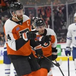 Jan 7, 2025; Philadelphia, Pennsylvania, USA; Philadelphia Flyers center Sean Couturier (14) and right wing Garnet Hathaway (19) point to Philadelphia Flyers right wing Travis Konecny (11) (not pictured) after he scored a goal against the Toronto Maple Leafs during the first period at Wells Fargo Center.