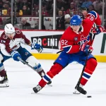 Mar 22, 2025; Montreal, Quebec, CAN; Montreal Canadiens right wing Patrik Laine (92) plays the puck against Colorado Avalanche right wing Valeri Nichushkin (13) in the second period at Bell Centre. Mandatory Credit: David Kirouac-Imagn Images