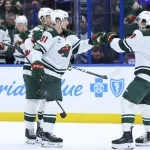 Mar 24, 2026; Tampa, Florida, USA; Minnesota Wild right wing Vladimir Tarasenko (91) reacts with defenseman Brock Faber (7) after scoring a goal against the Tampa Bay Lightning in the second period at Benchmark International Arena.