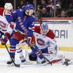 Apr 2, 2026; New York, New York, USA; Montréal Canadiens goaltender Jacob Fowler (32) defends against a shot on goal by New York Rangers left wing Adam Sykora (38) in the third period at Madison Square Garden.
