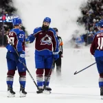 May 5, 2026; Denver, Colorado, USA; Colorado Avalanche defenseman Brett Kulak (27), defenseman Brent Burns (84) and center Brock Nelson (11) celebrate defeating the Minnesota Wild during the third period in game two of the second round of the 2026 Stanley Cup Playoffs at Ball Arena.