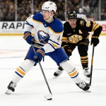 Apr 23, 2026; Boston, Massachusetts, USA; Buffalo Sabres defenseman Bowen Byram (4) skates against Boston Bruins right wing David Pastrnak (88) during the second period of game three of the first round of the 2026 Stanley Cup Playoffs at the TD Garden.
