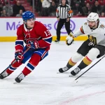 Nov 23, 2024; Montreal, Quebec, CAN; Montreal Canadiens right wing Cole Caufield (13) plays the puck against Las Vegas Golden Knights right wing Cole Schwindt (22) during the first period at Bell Centre.