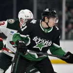 Apr 20, 2026; Dallas, Texas, USA; Dallas Stars left wing Jason Robertson (21) looks for the puck during the game between the Stars and the Wild in game two of the first round of the 2026 Stanley Cup Playoffs at American Airlines Center.