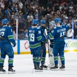 Apr 14, 2026; Vancouver, British Columbia, CAN; Vancouver Canucks forward Liam Ohgren (92) and defenseman Filip Hronek (17) and forward Ty Mueller (39) and forward Jake DeBrusk (74) and forward Elias Pettersson (40) and goalie Kevin Lankinen (32) celebrate their victory against the Los Angeles Kings in overtime at Rogers Arena.