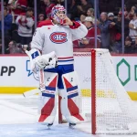17 janvier 2026; Ottawa (Ontario, Canada); Le gardien des Canadiens de Montréal, Samuel Montembeault (35), ajuste son masque pendant une pause de la première période contre les Sénateurs d'Ottawa au Centre Canadian Tire.