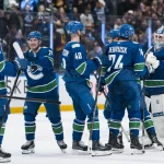 Canucks 'desperate' to complete blockbuster trade involving $92.8-million star Apr 14, 2026; Vancouver, British Columbia, CAN; Vancouver Canucks forward Ty Mueller (39) and forward Nils Hoglander (21) and forward Elias Pettersson (40) and forward Jake DeBrusk (74) and goalie Kevin Lankinen (32) celebrate their victory against the Los Angeles Kings in overtime at Rogers Arena.