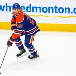 Jun 14, 2025; Edmonton, Alberta, CAN; Edmonton Oilers defenseman Darnell Nurse (25) skates with the puck against the Florida Panthers during the second period in game five of the 2025 Stanley Cup Final at Rogers Place.
