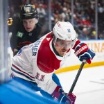 25 octobre 2025 ; Vancouver (Colombie-Britannique, Canada) ; le défenseur des Canucks de Vancouver, Elias Pettersson (25), se bat avec l'attaquant des Canadiens de Montréal, Brendan Gallagher (11), en première période au Rogers Arena.