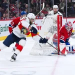 8 janvier 2026; Montréal, Québec, Canada; Le gardien des Canadiens de Montréal, Samuel Montembeault (35), effectue un arrêt face à l'ailier gauche des Panthers de la Floride, A.J. Greer (10), durant la deuxième période au Centre Bell.