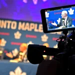 May 4, 2026; Toronto, Ontario, CANADA; Maple Leaf Sport and Entertainment CEO Keith Pelley is shown on a video camera monitor as he introduces the Toronto Maple Leafs new general manager John Chayka during an introductory news conference at Real Sports Bar and Grill. Mandatory Credit: Dan Hamilton-Imagn Images