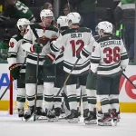 Apr 28, 2026; Dallas, Texas, USA; Minnesota Wild center Michael McCarron (47) and left wing Matt Boldy (12) and right wing Mats Zuccarello (36) celebrate the win over the Dallas Stars in game five of the first round of the 2026 Stanley Cup Playoffs at American Airlines Center.
