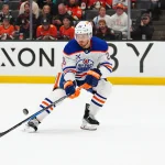 Apr 30, 2026; Anaheim, California, USA; Edmonton Oilers center Jack Roslovic (28) handles the puck against the Anaheim Ducks in the first period of game six of the first round of the 2026 Stanley Cup Playoffs at Honda Center. Mandatory Credit: Kirby Lee-Imagn Images
