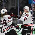 Apr 4, 2026; Seattle, Washington, USA; Chicago Blackhawks right wing Ilya Mikheyev (95) celebrates with left wing Tyler Bertuzzi (59) after scoring an empty net goal against the Seattle Kraken during the third period at Climate Pledge Arena.