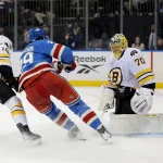 Jan 26, 2026; New York, New York, USA; New York Rangers defenseman Matthew Robertson (29) scores an overtime game winning goal against Boston Bruins goaltender Joonas Korpisalo (70) and center Pavel Zacha (18) at Madison Square Garden.