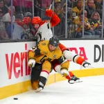 May 4, 2026; Las Vegas, Nevada, USA; Vegas Golden Knights center William Karlsson (71) slips underneath the check of Anaheim Ducks defenseman Jacob Trouba (65) during the third period of game one of the second round of the 2026 Stanley Cup Playoffs at T-Mobile Arena.