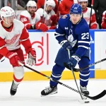 Jan 14, 2024; Toronto, Ontario, CAN; Toronto Maple Leafs forward Matthews Knies (23) stickhandles the puck away from Detroit Red Wings defenseman Olli Maatta (2) in the first period at Scotiabank Arena.