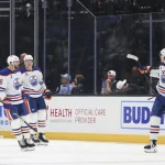 Apr 7, 2026; Salt Lake City, Utah, USA; The Edmonton Oilers celebrate a goal against the Utah Mammoth by center Colton Dach (34) during the third period at Delta Center.