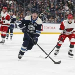 Mar 17, 2026; Columbus, Ohio, USA; Columbus Blue Jackets defenseman Zach Werenski (8) carries the puck as Carolina Hurricanes left wing Nikolaj Ehlers (27) trails the play during the second period at Nationwide Arena.