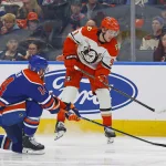 Apr 28, 2026; Edmonton, Alberta, CAN; Edmonton Oilers defensemen Mattias Ekholm (14) blocks a pass by Anaheim Ducks forward Leo Carlsson (91) during the second period in game five of the first round of the 2026 Stanley Cup Playoffs at Rogers Place. Mandatory Credit: Perry Nelson-Imagn Images