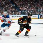 Jan 17, 2026; Vancouver, British Columbia, CAN; Edmonton Oilers forward Connor McDavid (97) defends against Vancouver Canucks forward Elias Pettersson (40) in the second period at Rogers Arena. Mandatory Credit: Bob Frid-Imagn Images