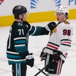 Apr 6, 2026; San Jose, California, USA; San Jose Sharks center Macklin Celebrini (71) and Chicago Blackhawks center Connor Bedard (98) meet during a break in the action in the third period at SAP Center at San Jose.