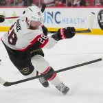 Apr 20, 2026; Raleigh, North Carolina, USA; Ottawa Senators right wing Claude Giroux (28) gets the shot away against the Carolina Hurricanes during the first overtime in game two of the first round of the 2026 Stanley Cup Playoffs at Lenovo Center.