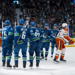 Mar 24, 2026; Vancouver, British Columbia, CAN; Vancouver Canucks forward Jake DeBrusk (74) and forward Brock Boeser (6) and forward Marco Rossi (93) and defenseman Filip Hronek (17) and forward Elias Pettersson (40) celebrate Boeser's goal against the Anaheim Ducks in the second period at Rogers Arena.