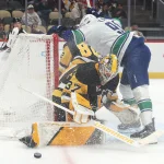 Oct 21, 2025; Pittsburgh, Pennsylvania, USA; Pittsburgh Penguins goaltender Arturs Silovs (37) makes a save against Vancouver Canucks left wing Evander Kane (91) during the first period at PPG Paints Arena.