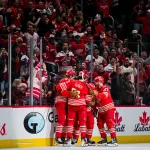 Mar 19, 2026; Detroit, Michigan, USA; Detroit Red Wings right wing Alex DeBrincat (93) celebrates with defenseman Simon Edvinsson (77) and left wing J.T. Compher (37) after scoring a goal during the third period against the Montreal Canadiens at Little Caesars Arena. Mandatory Credit: Tim Fuller-Imagn Images