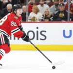 Apr 13, 2026; Chicago, Illinois, USA; Chicago Blackhawks center Connor Bedard (98) looks to pass the puck against the Buffalo Sabres during the first period at United Center.
