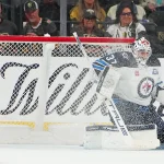 Apr 13, 2026; Las Vegas, Nevada, USA; Winnipeg Jets goaltender Connor Hellebuyck (37) makes a save against the Vegas Golden Knights during the first period at T-Mobile Arena. Mandatory Credit: Stephen R. Sylvanie-Imagn Images
