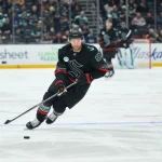Jan 6, 2026; Seattle, Washington, USA; Seattle Kraken center Shane Wright (51) advances the puck against the Boston Bruins during the second period at Climate Pledge Arena. Mandatory Credit: Steven Bisig-Imagn Images