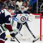 Mar 28, 2026; Denver, Colorado, USA; Winnipeg Jets goaltender Connor Hellebuyck (37) defends his net in the first period against the Colorado Avalanche at Ball Arena.