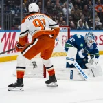 Mar 24, 2026; Vancouver, British Columbia, CAN; Vancouver Canucks goalie Kevin Lankinen (32) makes a save on Anaheim Ducks forward Leo Carlsson (91) in the first period at Rogers Arena.