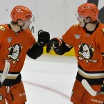 Apr 9, 2025; Anaheim, California, USA; Anaheim Ducks left wing Cutter Gauthier (61) is congratulated by center Leo Carlsson (91) after a goal during the third period against the Calgary Flames as Honda Center.