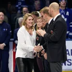 Nov 15, 2019; Toronto, Ontario, CAN; Class of 2019 Hockey Hall of Fame inductee Hayley Wickenheiser shakes hands with hall of famers prior to a game between the Boston Bruins and Toronto Maple Leafs at Scotiabank Arena. Mandatory Credit: John E. Sokolowski-Imagn Images