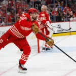 Mar 28, 2026; Detroit, Michigan, USA; Detroit Red Wings center Dylan Larkin (71) skates with the puck in the first period against the Philadelphia Flyers at Little Caesars Arena.