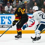Jan 31, 2026; Vancouver, British Columbia, CAN; Vancouver Canucks forward Elias Pettersson (40) handles the puck against the Toronto Maple Leafs in overtime at Rogers Arena.