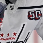 Dec 16, 2024; Dallas, Texas, USA; A view of the 50 year logo on the jersey of Washington Capitals goaltender Charlie Lindgren (79) during the game between the Dallas Stars and the Washington Capitals at American Airlines Center.