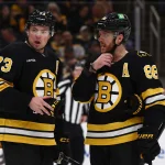 Mar 24, 2026; Boston, Massachusetts, USA; Boston Bruins defenseman Charlie McAvoy (73) talks with right wing David Pastrnak (88) during the third period against the Toronto Maple Leafs at TD Garden