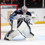 Feb 27, 2026; Anaheim, California, USA; Winnipeg Jets goaltender Connor Hellebuyck (37) defends the goal during the first period against the Anaheim Ducks at Honda Center.