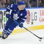 Dec 8, 2025; Toronto, Ontario, CAN; Toronto Maple Leafs defenseman Morgan Rielly (44) carries th epuck against the Tampa Bay Lightning during the second period at Scotiabank Arena. Mandatory Credit: John E. Sokolowski-Imagn Images