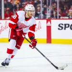 Feb 17, 2024; Calgary, Alberta, CAN; Detroit Red Wings right wing Patrick Kane (88) controls the puck against the Calgary Flames during the second period at Scotiabank Saddledome.
