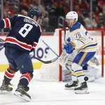 Mar 15, 2023; Washington, District of Columbia, USA; Washington Capitals left wing Alex Ovechkin (8) attempts to bat the puck out of the air as Buffalo Sabres defenseman Jacob Bryson (78) defends in the third period at Capital One Arena.