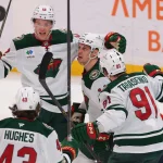 Mar 26, 2026; Sunrise, Florida, USA; Minnesota Wild center Joel Eriksson Ek (14) celebrates with left wing Matt Boldy (12), defenseman Quinn Hughes (43), and right wing Vladimir Tarasenko (91) after scoring against the Florida Panthers during the third period at Amerant Bank Arena.